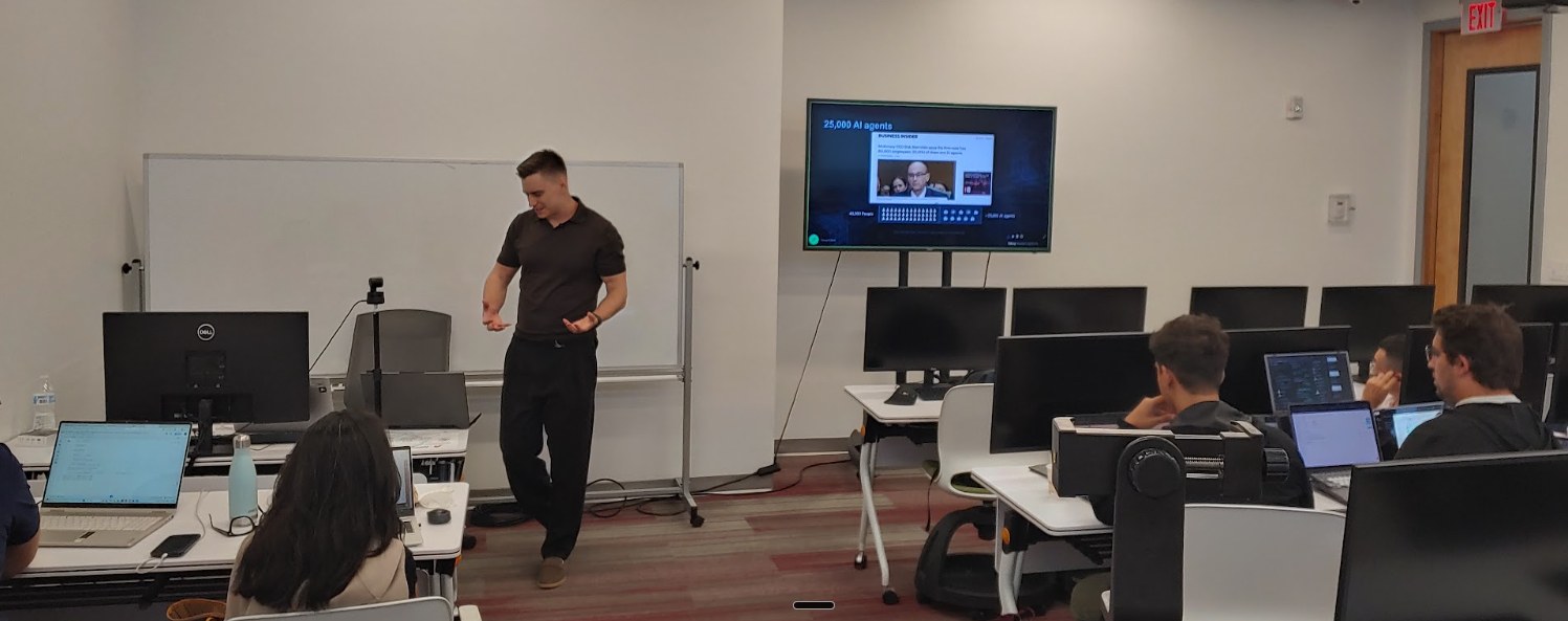 Ihor Parinov explaining production AI agents to Atlantis University students